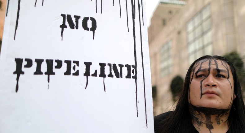 People protest against President Donald Trump's executive order fast-tracking the Keystone XL and Dakota Access oil pipelines in Los Angeles.