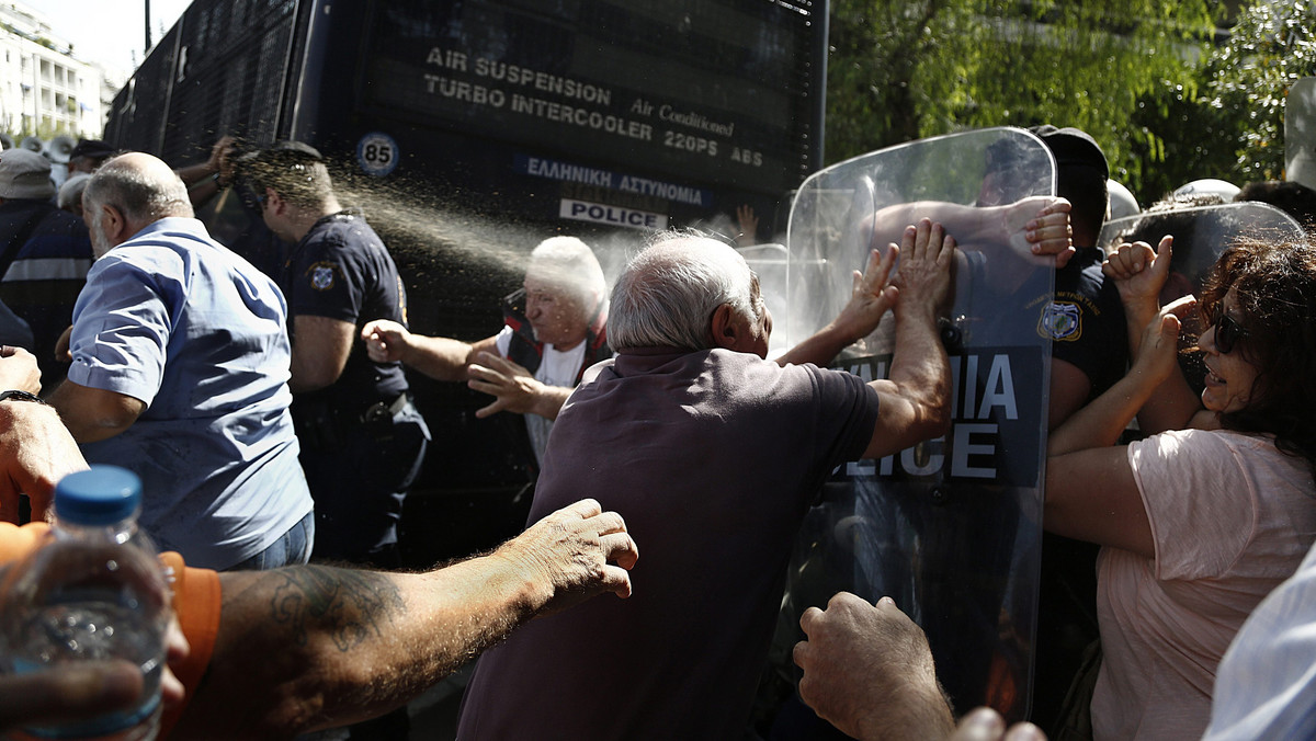 GREECE PENSIONERS PROTEST (Greek pensioners scuffle with riot police during an anti-austerity protest in Athens )
