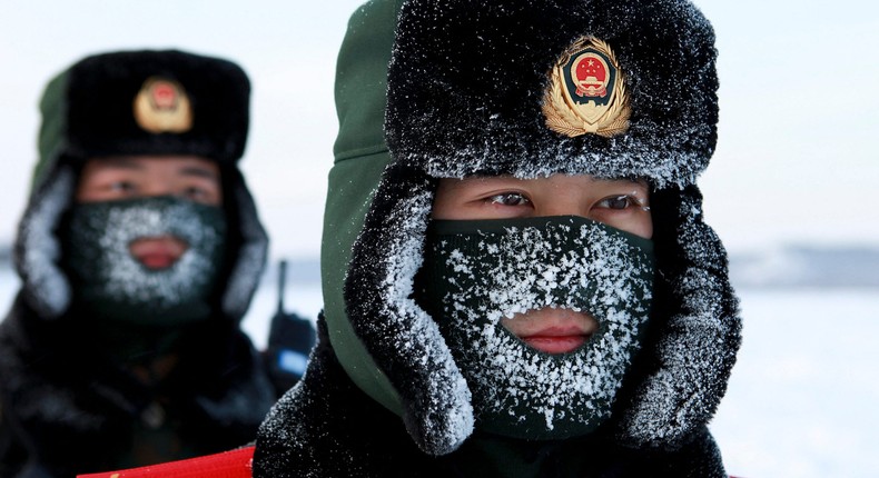 Chinese paramilitary police border guards train in the snow at Mohe County in China's northeast Heilongjiang province, on the border with Russia, on December 12, 2016.STR/AFP via Getty Images