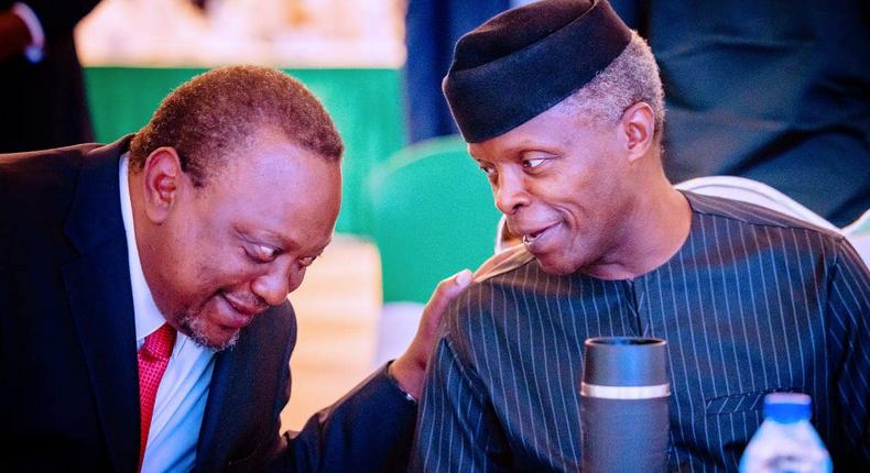 Uhuru Kenyatta shares a light moment with Nigerian Vice President Professor Yemi Osinbajo on October 17, 2022