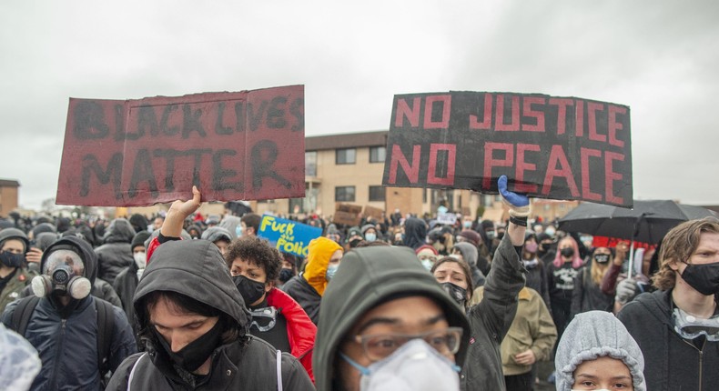 Protesters gathered outside of the Brooklyn Center police station at a protest over the police killing of Daunte Wright in Brooklyn Center, Minnesota, U.S., on April 13, 2021.
