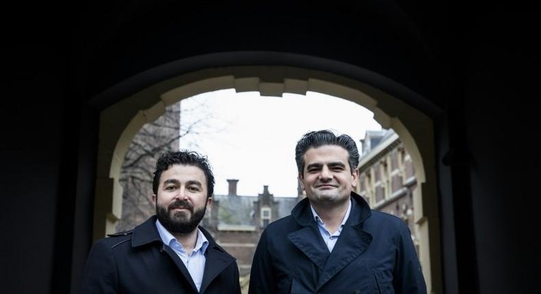 Leader of DENK (think in Dutch), the country's first party led by immigrants, Tunahan Kuzu (R) and Selcuk Ozturk pose at the Binnenhof in The Hague