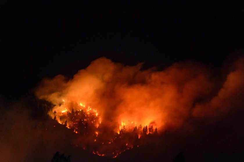 A sky glows red from a nearby fire from San Pedro de la Paz, Concepcion