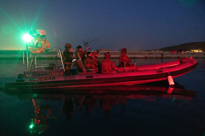 Croatian naval special forces and members of US Naval Special Warfare do a night-time dive exercise in Croatia during exercise Trojan Footprint, May 4, 2022.