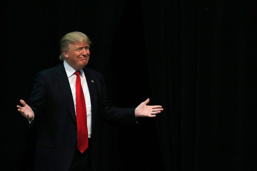 U.S. Republican presidential candidate Trump reacts as he is introduced during a campaign event in C