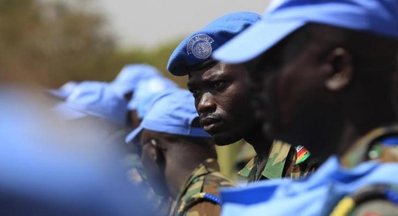 Ghanian U.N. peacekeepers stand at attention upon arriving in Juba February 28, 2014. 