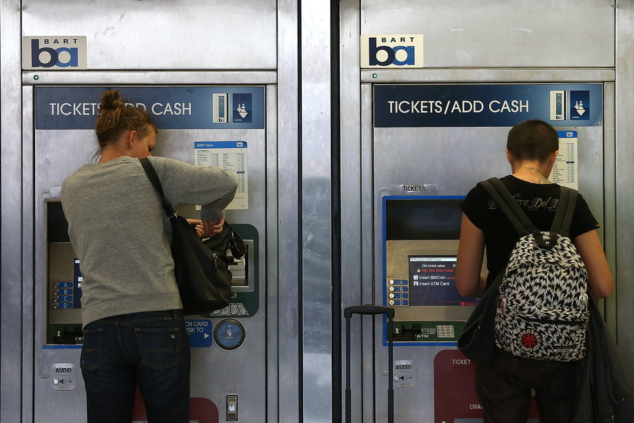 Bay Area Rapid Transit (BART) passengers pay for tickets in San Francisco.