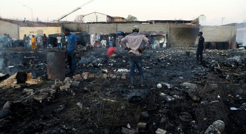 Foreigners in Marabastad, in the Pretoria area, try to save their belongings after their shacks were set alight in last month's attacks