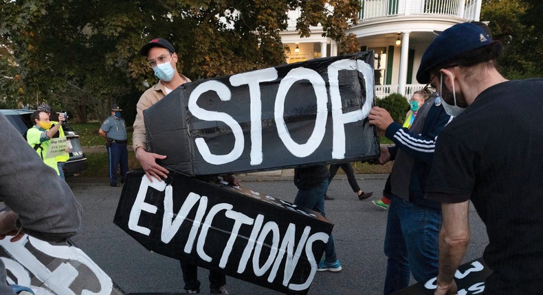 Housing activists erect a sign in front of Massachusetts Gov. Charlie Baker's house in Swampscott, Mass.
