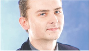 Guza: Śmieciowe umowy pomagają młodym