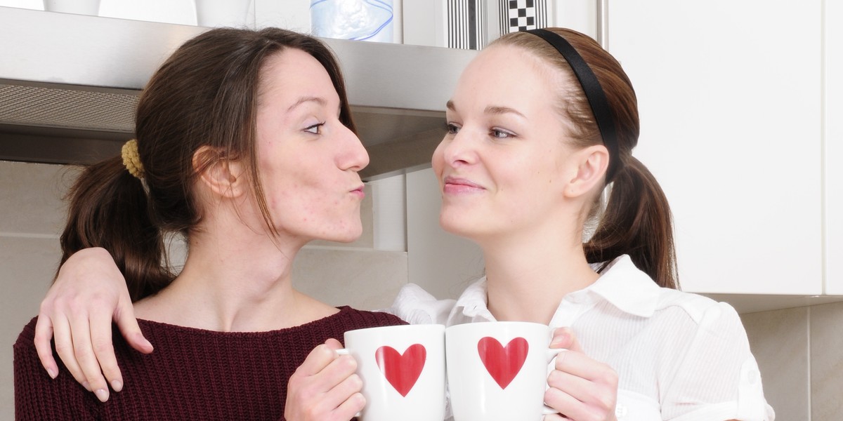 two young beautiful women in the kitchen