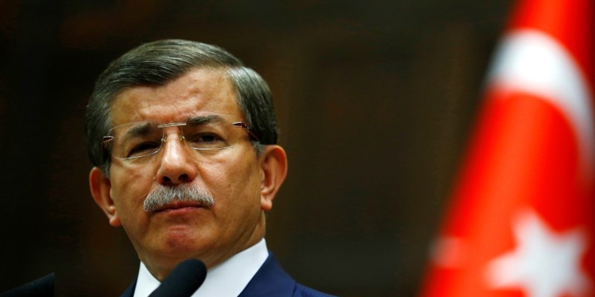 Turkey's Prime Minister Ahmet Davutoglu addresses members of parliament from his ruling AK Party at the Turkish parliament in Ankara