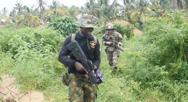 An officer of the Nigerian Navy Special Boat Service (left) during the five-week Joint Combined Exchange Training (JCET) alongside a team of U.S. Army Special Forces [U.S. Consulate]