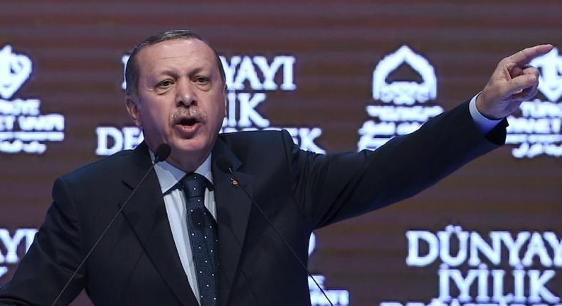 Turkish President Recep Tayyip Erdogan gestures as he speaks in Istanbul on March 12, 2017