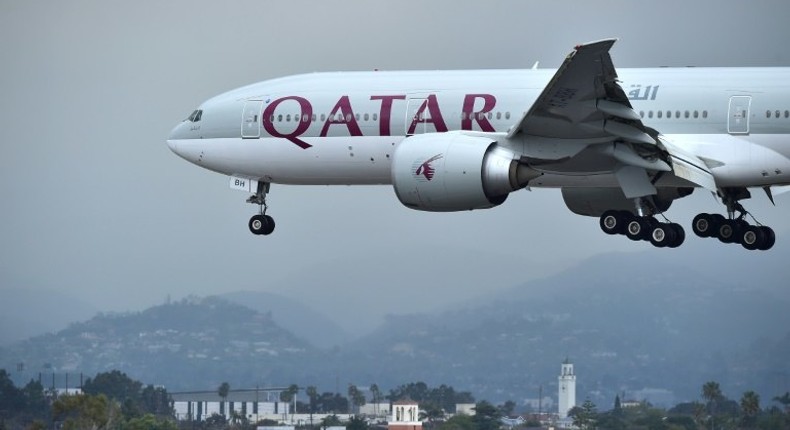 A Qatar Airways plane lands at Los Angeles International Airport