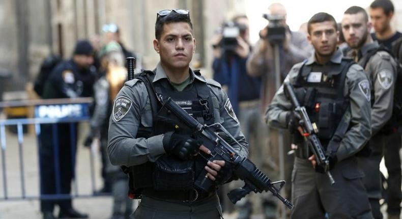 Israeli security forces stand guard at a street in Jerusalem's Old City following a previous stabbing attack on April 1, 2017