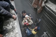 Syria Civil Defence members help an unconscious woman from a shelter in the besieged town of Douma