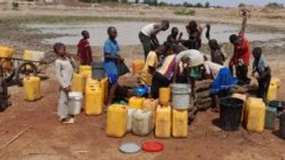 Residents struggling to fetch water from a pond in Sabongida community of Langtang South. [NAN]