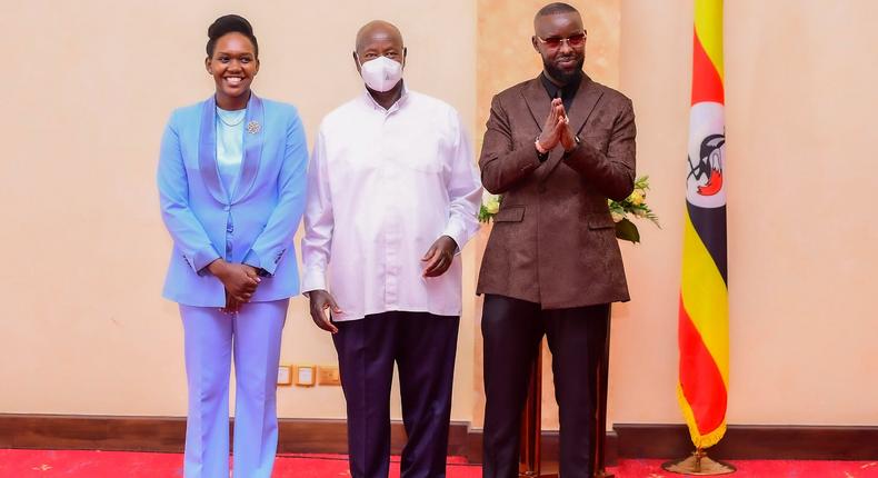 Phiona Nyamutoro and Eddy Kenzo posing with President Yoweri Museveni
