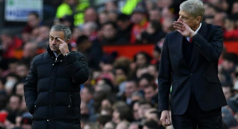 Manchester United's manager Jose Mourinho and Arsenal's manager Arsene Wenger watch their players from the touchline during the match on November 19, 2016