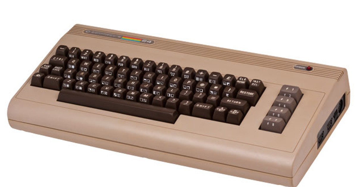 A vintage Commodore 64 computer with a beige casing and dark brown keys.