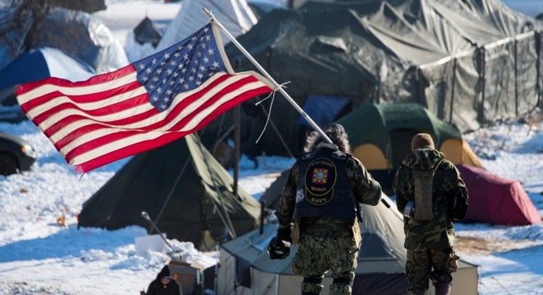 US military veterans joined protests against a controversial planned oil pipeline that have led the Army Corps of Engineers to rethink the route