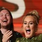 Adele breaks the Grammy for Record of the Year for Hello after having it presented to her at the 59th Annual Grammy Awards in Los Angeles