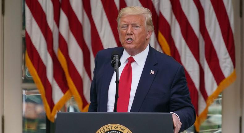 FILE - In this Tuesday, May 26, 2020 file photo, President Donald Trump answers questions from reporters during an event on protecting seniors with diabetes in the Rose Garden White House in Washington. On Tuesday, Twitter took the unprecedented step of adding fact-check alerts to two of Trump's tweets about voting by mail. The next day the president threatened social media companies with new regulation or even shuttering. (AP Photo/Evan Vucci, File)