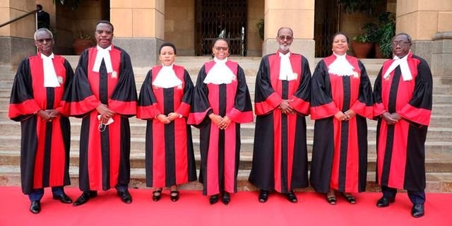 Chief Justice and President of the Supreme Court Martha Koome (centre) and Deputy Chief Justice and Vice-President of the Supreme Court Philomena Mwilu (third left) with Supreme Court Judges (from left) Isaac Lenaola, Dr Smokin Wanjala, Mohamed  Ibrahim, Njoki Ndung’u and William Ouko at the Supreme Court Building in Nairobi. Jeff Angote | Nation Media Group