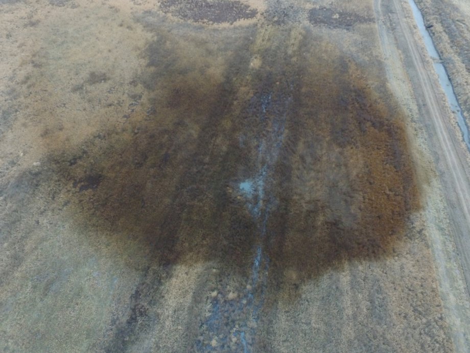 An aerial view shows the darkened ground of an oil spill which shut down the Keystone pipeline between Canada and the United States, located in an agricultural area near Amherst, South Dakota, U.S., in this photo provided November 18, 2017.