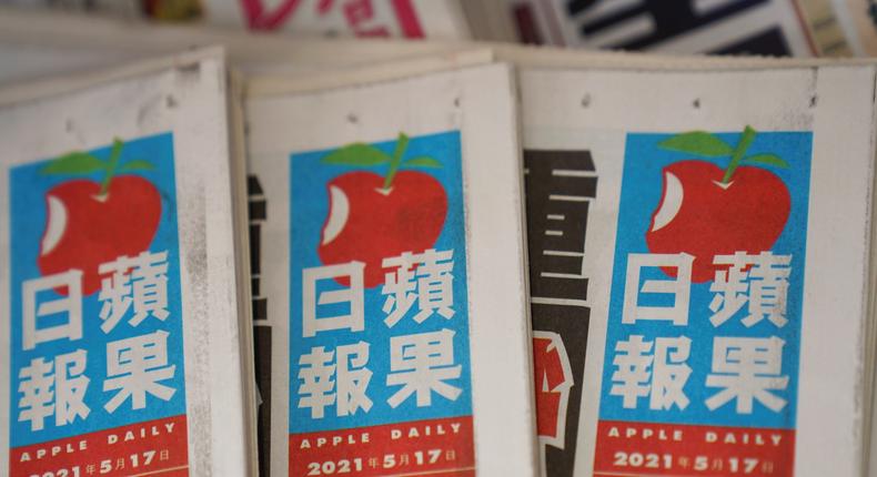 Copies of Apple Daily newspapers at a Hong Kong newsstand.
