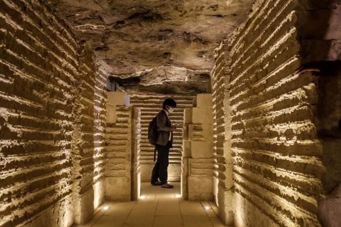 A journalist tours inside the step pyramid of Djoser in Egypt's Saqqara necropolis, south of the capital Cairo, on March 5, 2020. 