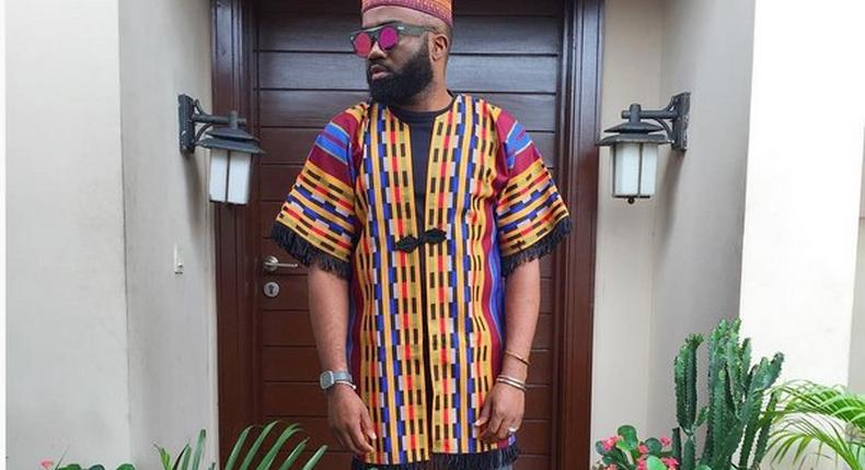 Noble Igwe gives a pop of colour to his outfit with a tribal kimono