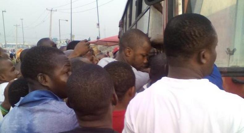 Commuters struggle to board a BRT in Lagos