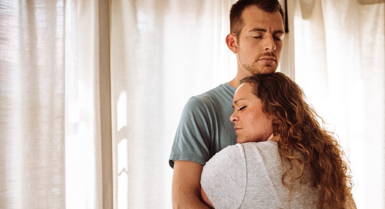 The author, not pictured, leans on her husband for support during IVF treatment.franckreporter/Getty Images