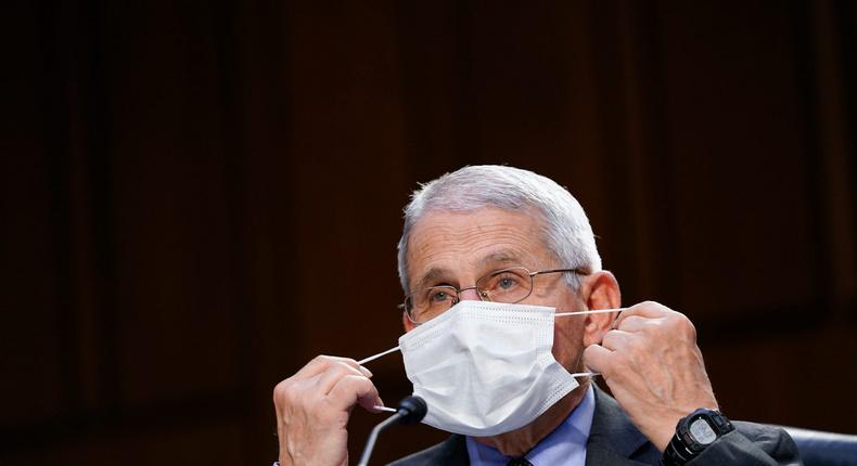 Dr. Anthony Fauci, director of the National Institute of Allergy and Infectious Diseases, adjusts a face mask during a Senate Health, Education, Labor and Pensions Committee hearing on the federal coronavirus response on Capitol Hill in Washington, Thursday, March 18, 2021.
