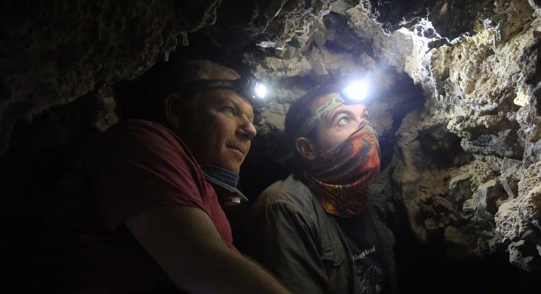 Archaeologists Oren Gutfeld and Ahiad Ovadia survey the cave.