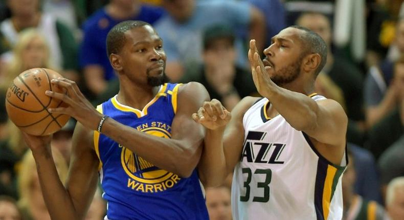 Boris Diaw of the Utah Jazz defends against Kevin Durant of the Golden State Warriors in Game Three of the Western Conference Semifinals