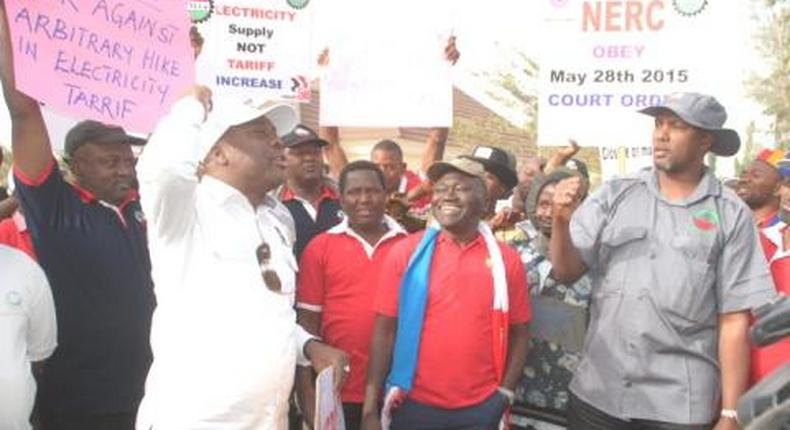 L-R: Chairman NLC Kaduna state comrade Ango Adamu with the general secretary NUTGTWN Comarade Issa Aremu and the chairman TUC Kaduna state comrade Shehu Umar a the picketing by labour and civil society allies of the office of electricity disstribution companies.