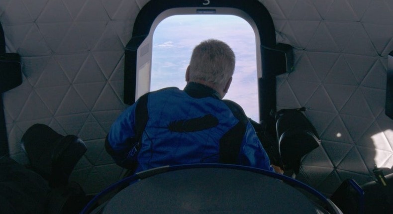 William Shatner looking out the window of Blue Origin.Blue Origin