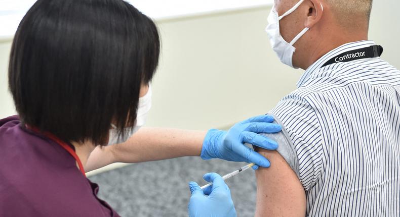 An employee of Japan's Suntory Holdings receives the Moderna coronavirus vaccine for Covid-19.
