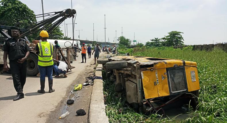 The commercial vehicle that fell into canal in front of National Arts Theatre, Iganmu, Lagos on Monday (NAN)