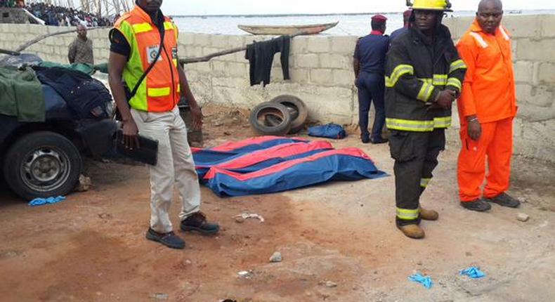 NEMA officials at the scene of a helicopter crash in Oworonshoki, Lagos on August 12, 2015