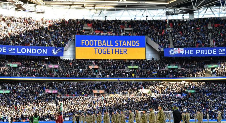 A 'Football Stands Together' message is displayed in Ukrainian colours ahead of the English League Cup final football match between Chelsea and Liverpool at Wembley Stadium Creator: JUSTIN TALLIS