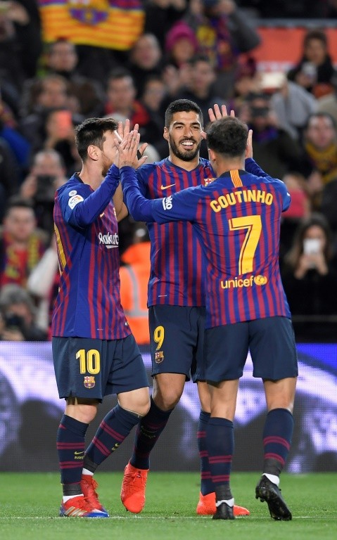 Messi, Luis Suarez and Philippe Coutinho celebrate one of Barcelona's goals in last week's win over Eibar