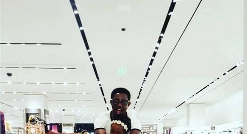 AY Makun and his daughter in a mall in Houston during their vacation 