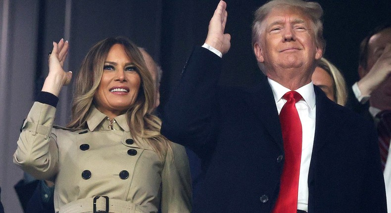 Former first lady and president of the United States Melania and Donald Trump do the chop prior to Game Four of the World Series between the Houston Astros and the Atlanta Braves Truist Park on October 30, 2021 in Atlanta, Georgia.
