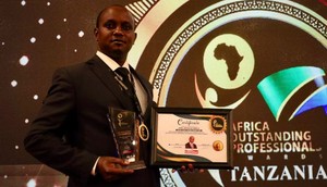 Makueni County Assembly Speaker Douglas Mbilu with his award in Tanzania