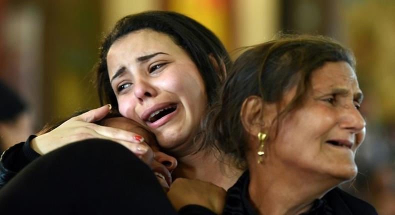 Women mourn the victims of a bombing at the Coptic Christian Saint Mark's church in Alexandria during a funeral procession in Borg El-Arab, east of the city, on April 10, 2017