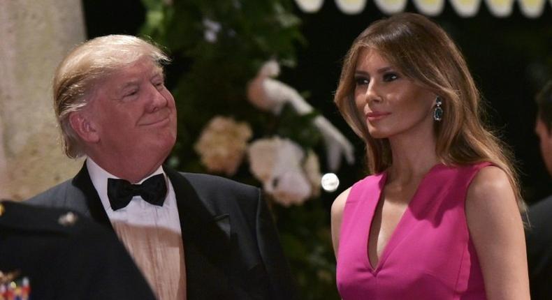 US President Donald Trump and First Lady Melania Trump arrive for the 60th Annual Red Cross Gala at his Mar-a-Lago estate in Palm Beach